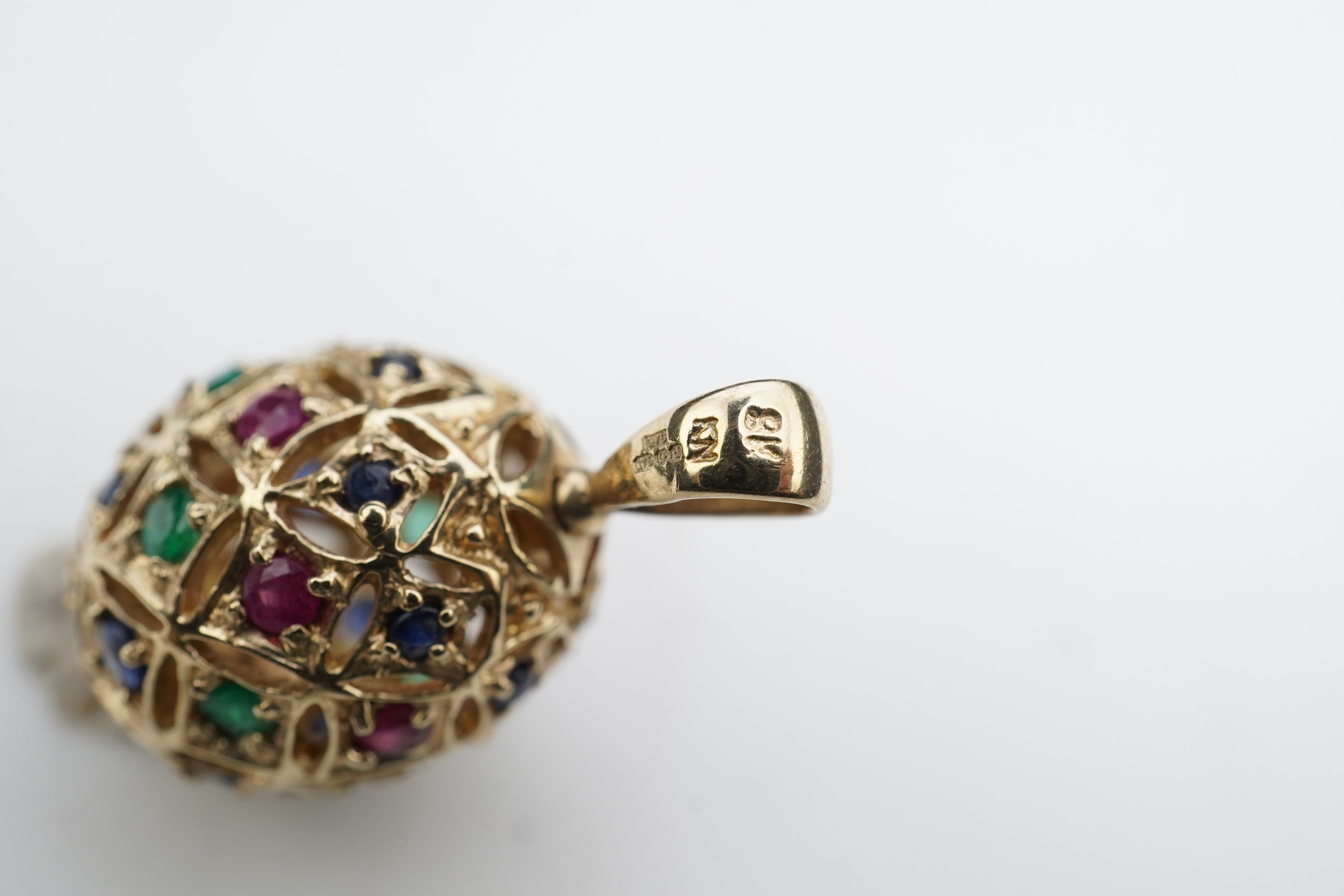 A gem-set egg pendant and an Edwardian seed pearl pendant